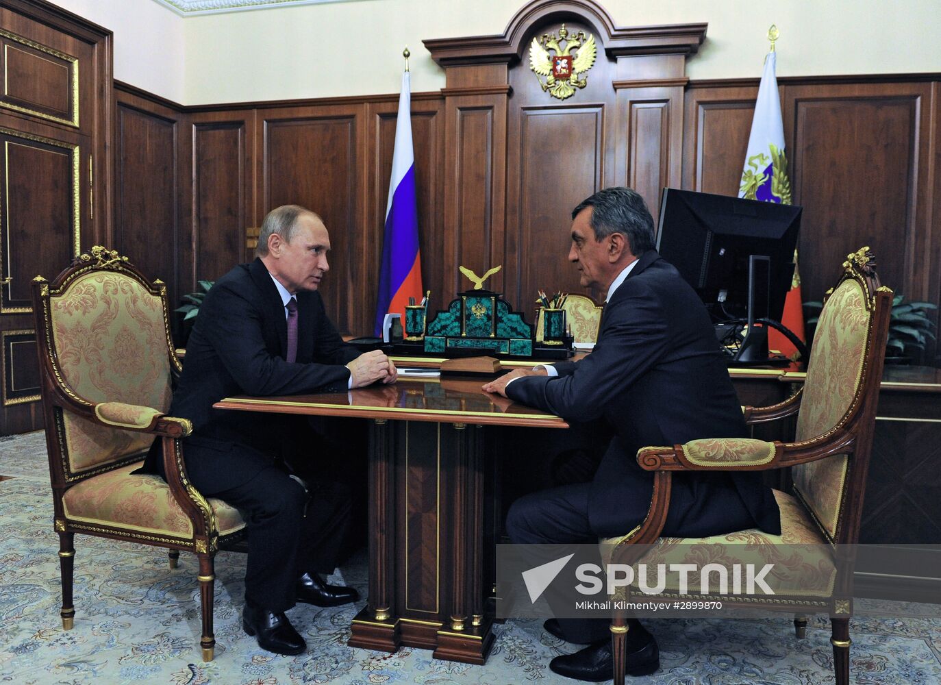 Russian President Vladimir Putin meets with Sergei Menyailo