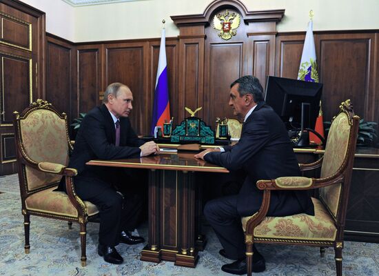 Russian President Vladimir Putin meets with Sergei Menyailo