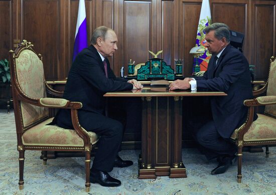 Russian President Vladimir Putin meets with Oleg Belaventsev