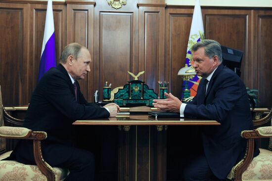 Russian President Vladimir Putin meets with Oleg Belaventsev