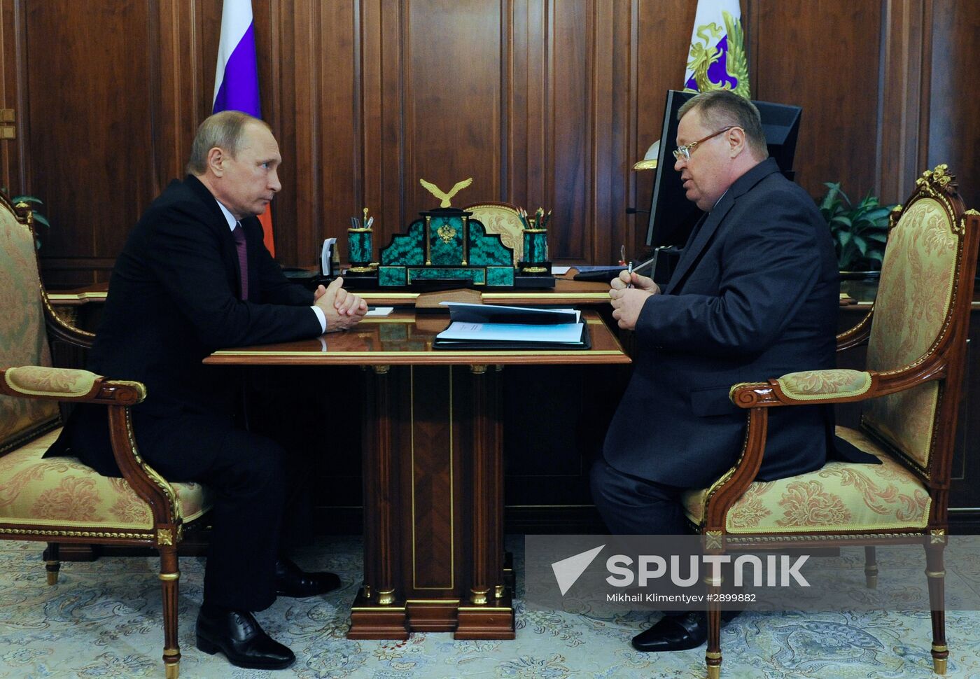 Russian President Vladimir Putin meets with Vladimir Ustinov