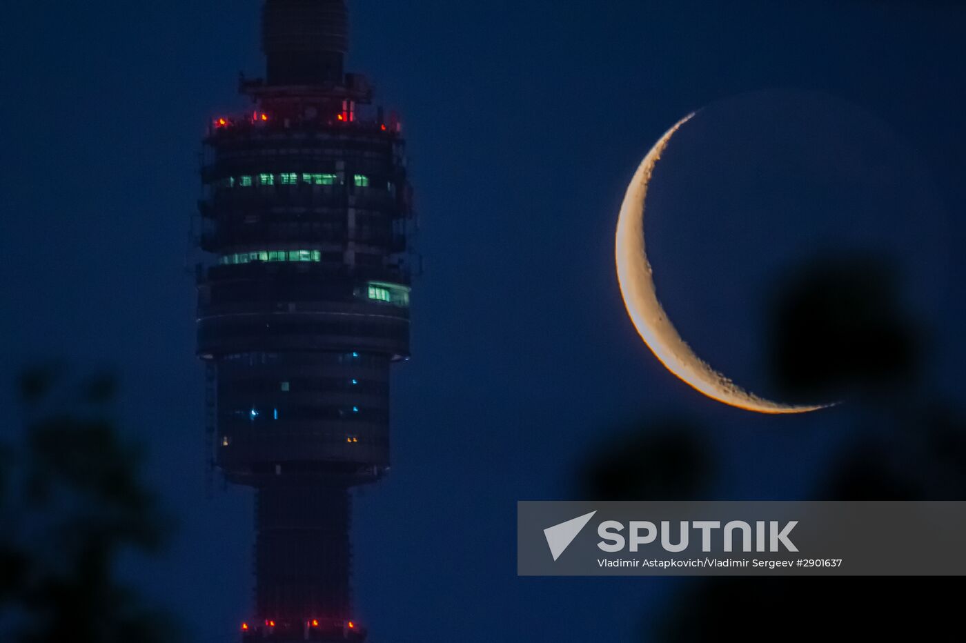 Observation plarform of the Ostankino TV tower against the background of the decrescent Moon