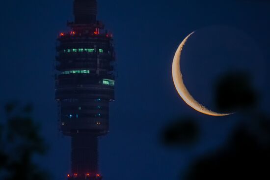 Observation plarform of the Ostankino TV tower against the background of the decrescent Moon
