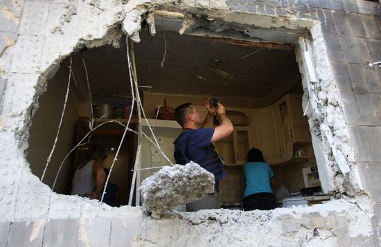Aftermath of shelling in Yasinovataya, Donbass