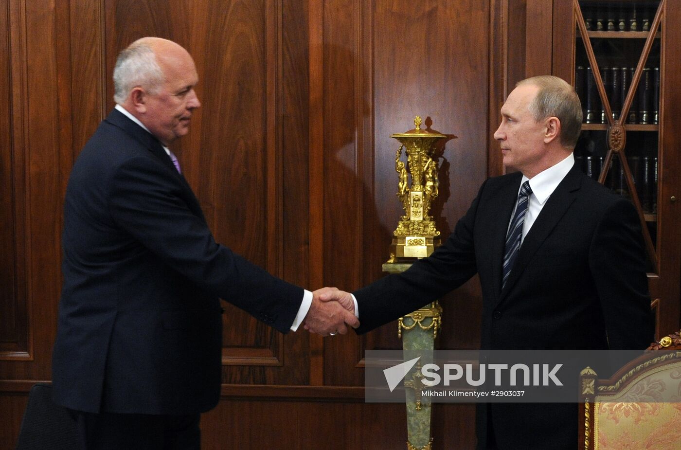 Russian President Vladimir Putin meets with Rostec Corporation CEO Sergei Chemezov