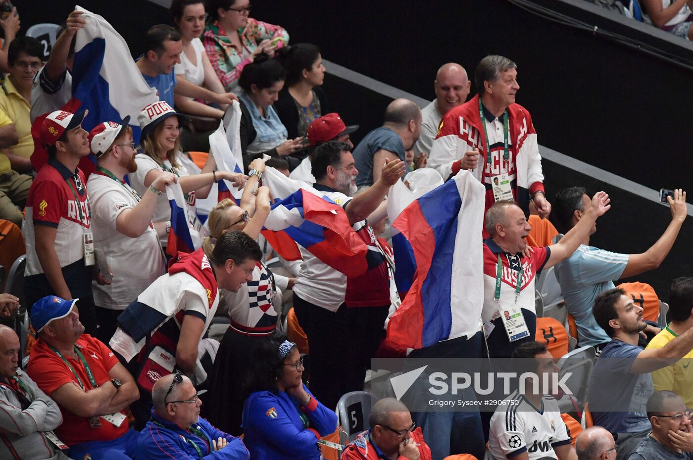 Head of Bosco di Ciliegi Group Mikhail Kusnirovich, center, during a group B match of men's volleyball between the Russian and Cuban national teams at the at the XXXI Summer Olympics. Location: Brazil, Rio de Janeiro. Author: Grigory Sysoev/Sputnik. 2016 Summer Olympics. Volleyball. Men. Russia vs. Cuba