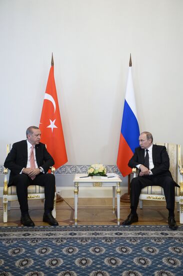 Russian President Vladimir Putin meets with Turkish President Recep Tayyip Erdogan in St. Petersburg