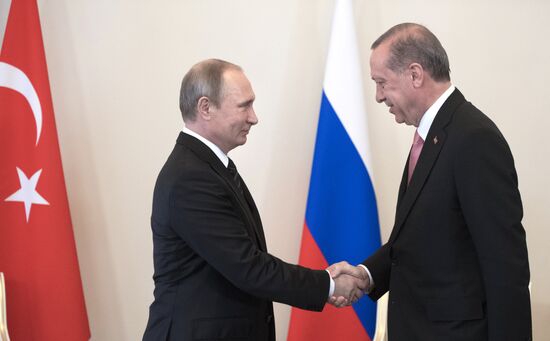 Russian President Vladimir Putin meets with Turkish President Recep Tayyip Erdogan in St. Petersburg