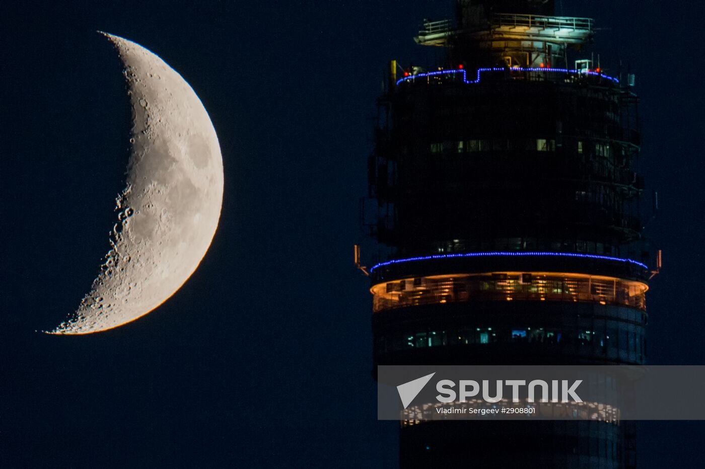 Ostankino TV Tower observation deck and waxing moon in Moscow