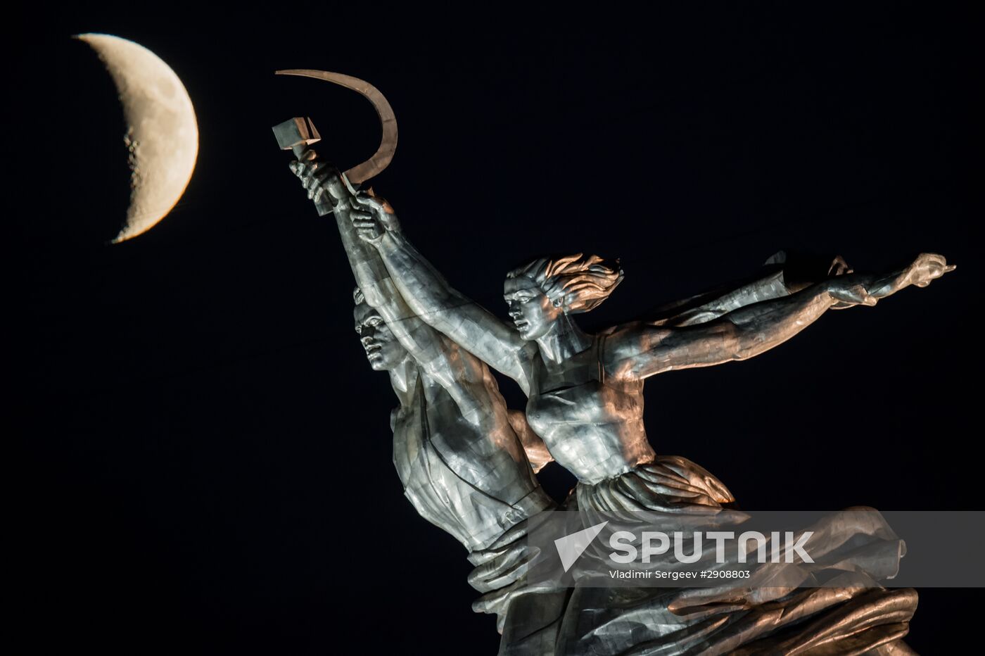Worker and Collective Farm Woman monument and waxing moon in Moscow