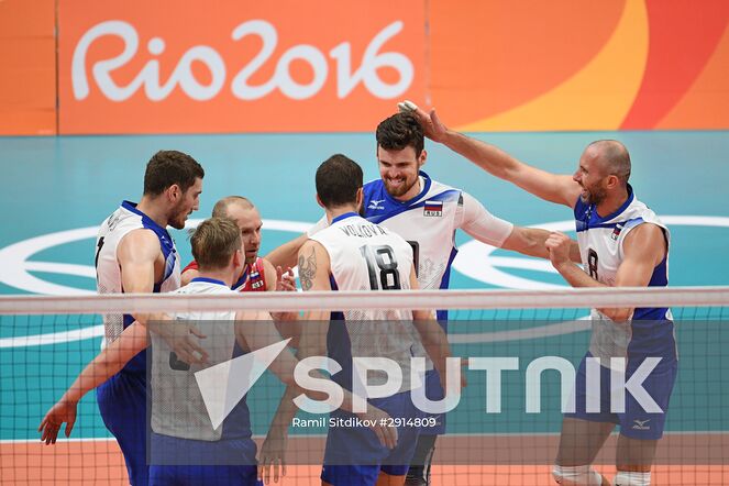 Russian players celebrate victory in the quarterfinals of the men's volleyball between Canada and Russia at the XXXI Summer Olympics. Location: Brazil, Rio de Janeiro. Author: Ramil Sitdikov/Sputnik. The 2016 Summer Olympics. Volleyball. Men. Canada vs. Russia