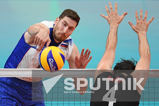Russia's Maxim Mikhailov, left, during the quarterfinals of the men's volleyball between Canada and Russia at the XXXI Summer Olympics. Location: Brazil, Rio de Janeiro. Author: Ramil Sitdikov/Sputnik. The 2016 Summer Olympics. Volleyball. Men. Canada vs. Russia