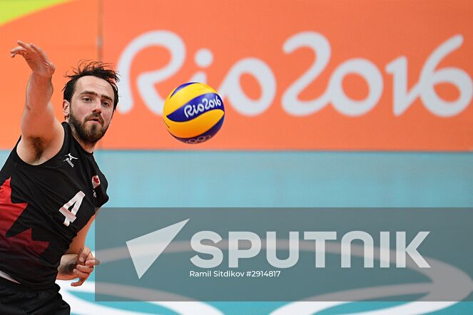 Canada's Nicholas Hoag during the quarterfinals of the men's volleyball between Canada and Russia at the XXXI Summer Olympics. Location: Brazil, Rio de Janeiro. Author: Ramil Sitdikov/Sputnik. The 2016 Summer Olympics. Volleyball. Men. Canada vs. Russia