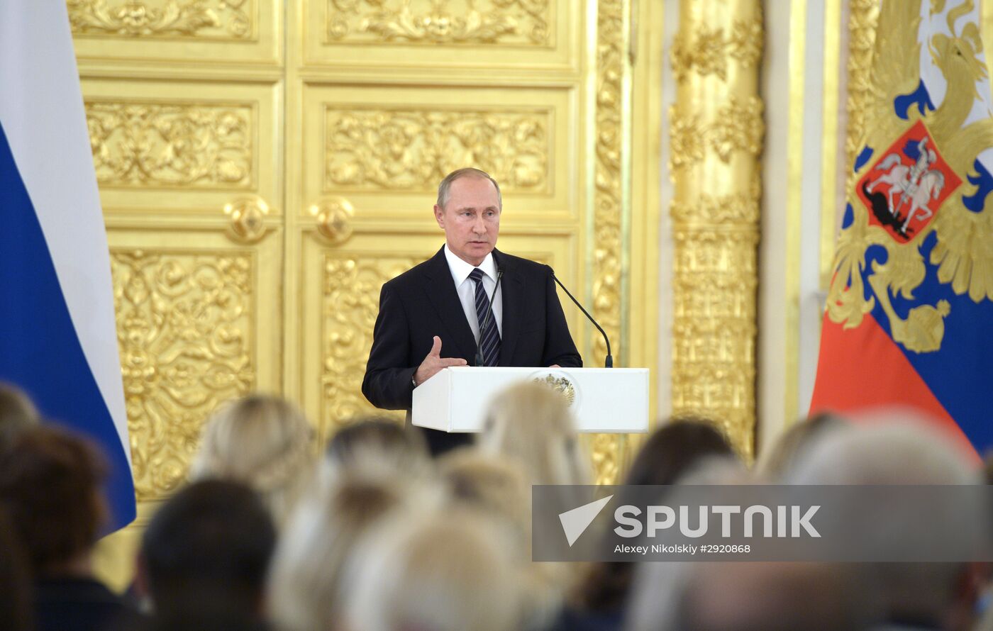 President Vladimir Putin gives government awards to Olympic medalists