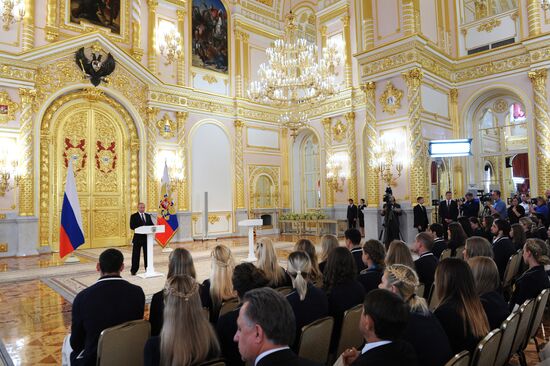 President Vladimir Putin gives government awards to Olympic medalists