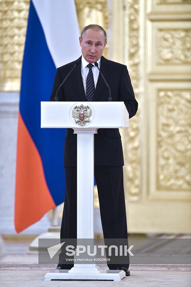 President Vladimir Putin gives government awards to Olympic medalists