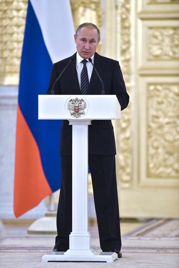 President Vladimir Putin gives government awards to Olympic medalists