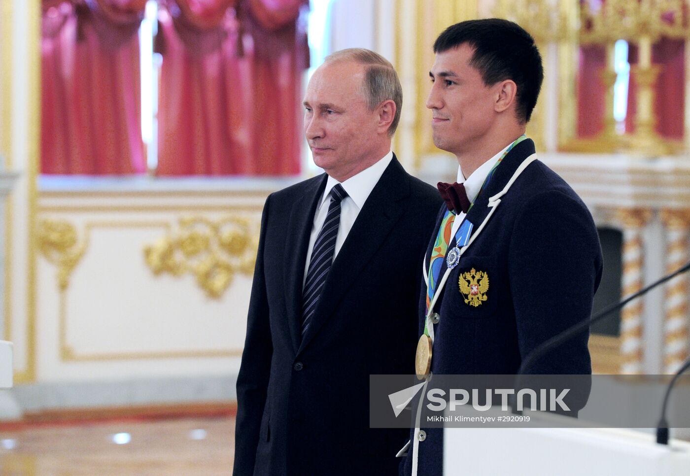 President Vladimir Putin gives government awards to Olympic medalists