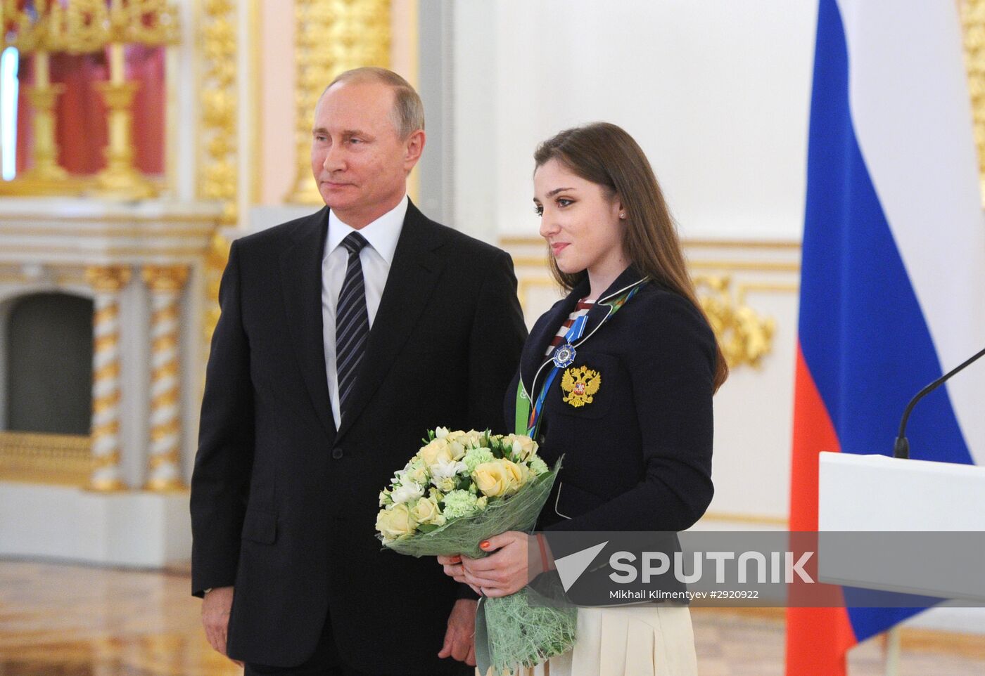 President Vladimir Putin gives government awards to Olympic medalists