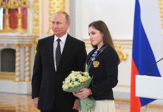 President Vladimir Putin gives government awards to Olympic medalists