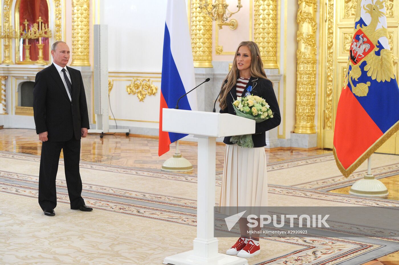 President Vladimir Putin gives government awards to Olympic medalists