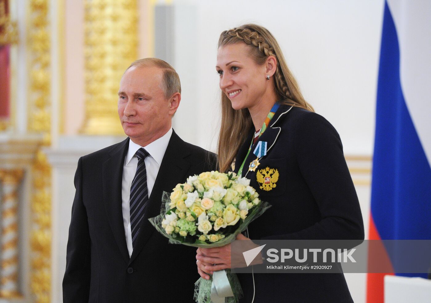 President Vladimir Putin gives government awards to Olympic medalists