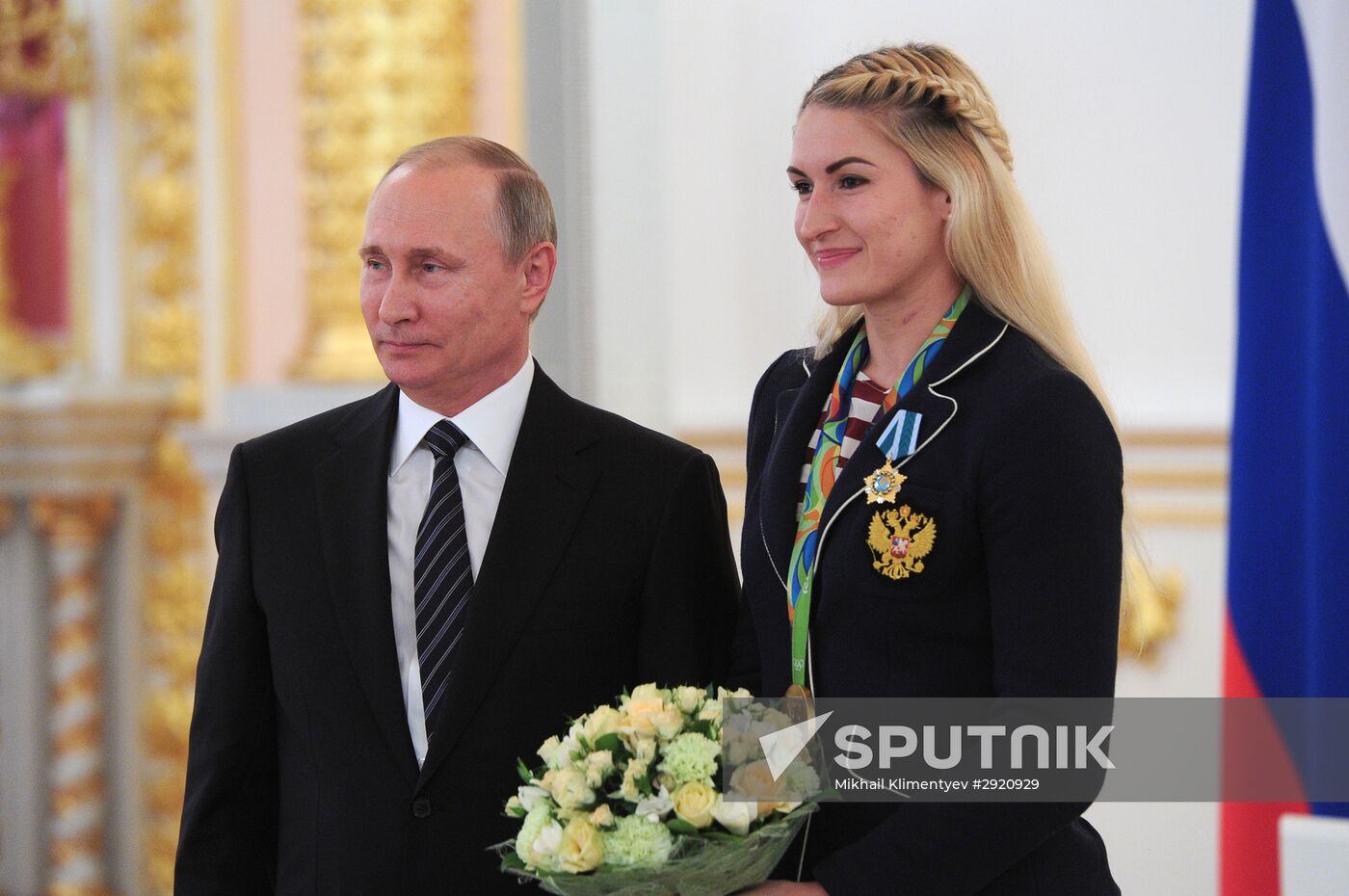 President Vladimir Putin gives government awards to Olympic medalists