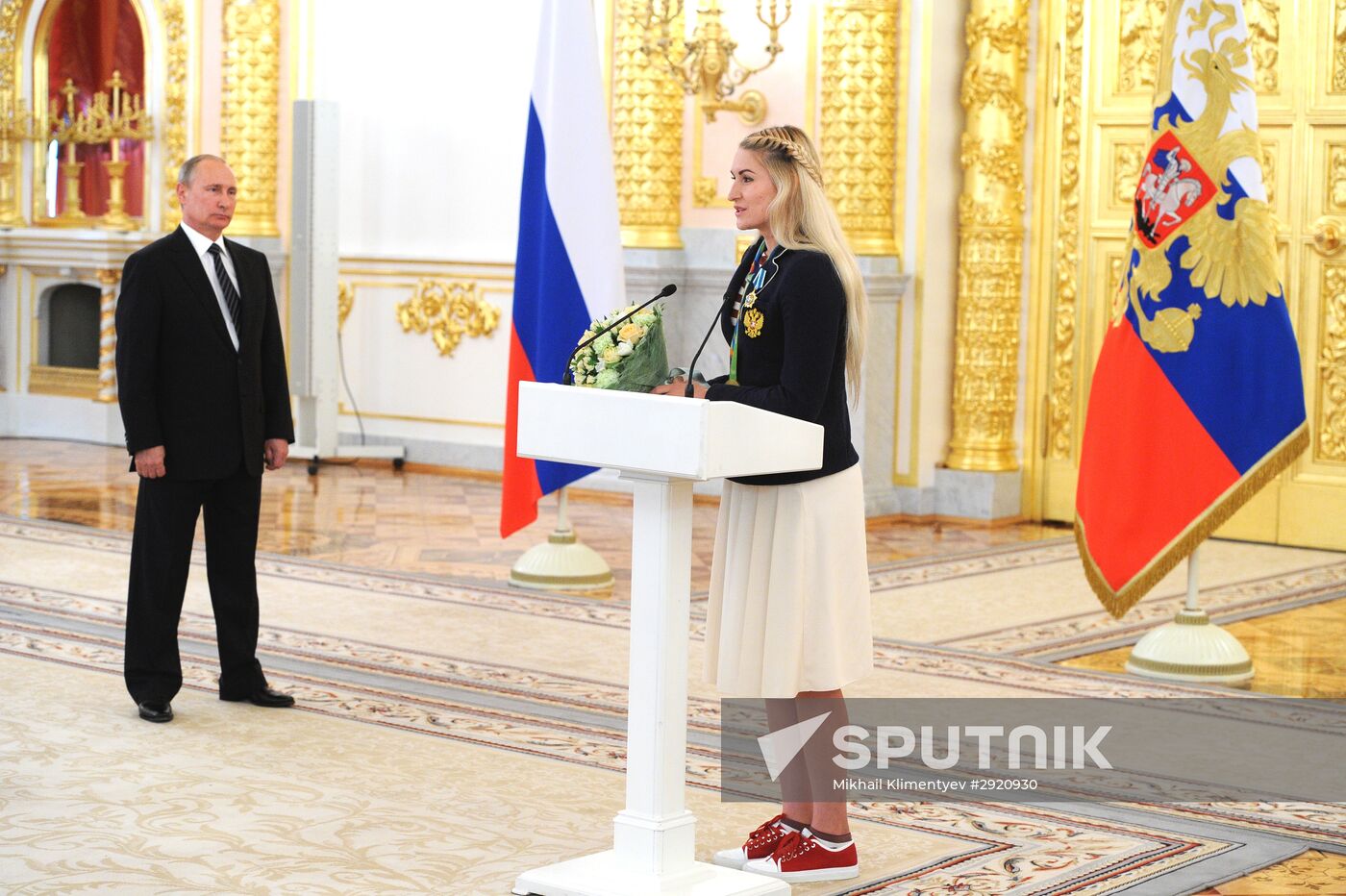 President Vladimir Putin gives government awards to Olympic medalists