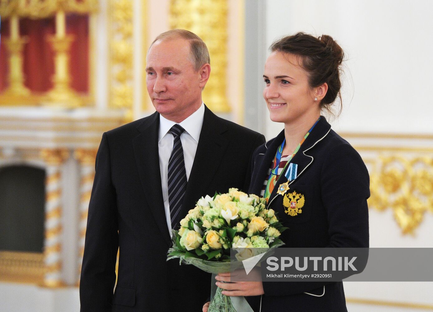 President Vladimir Putin gives government awards to Olympic medalists