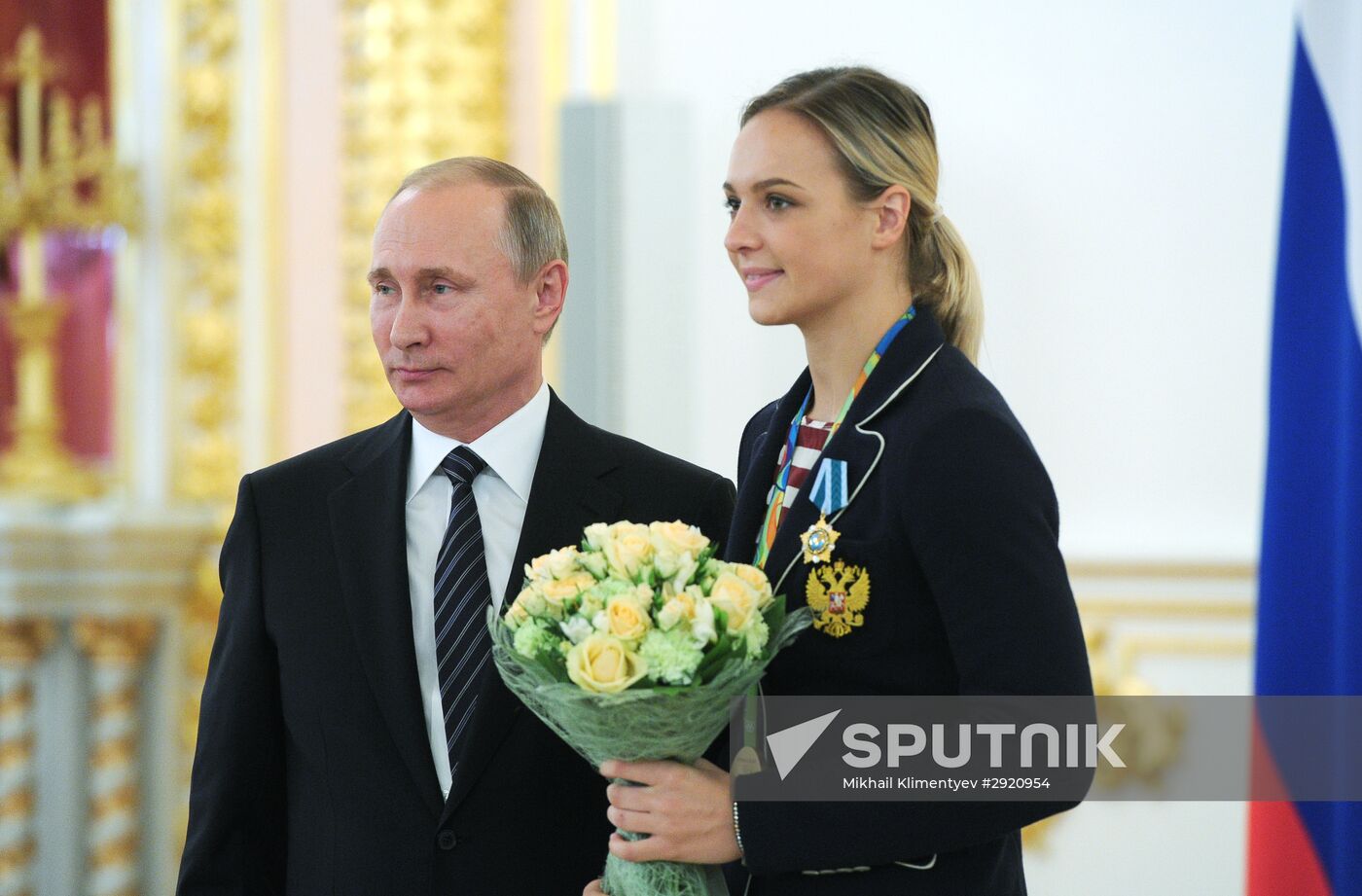 President Vladimir Putin gives government awards to Olympic medalists