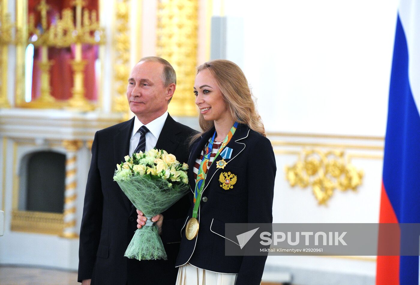 President Vladimir Putin gives government awards to Olympic medalists