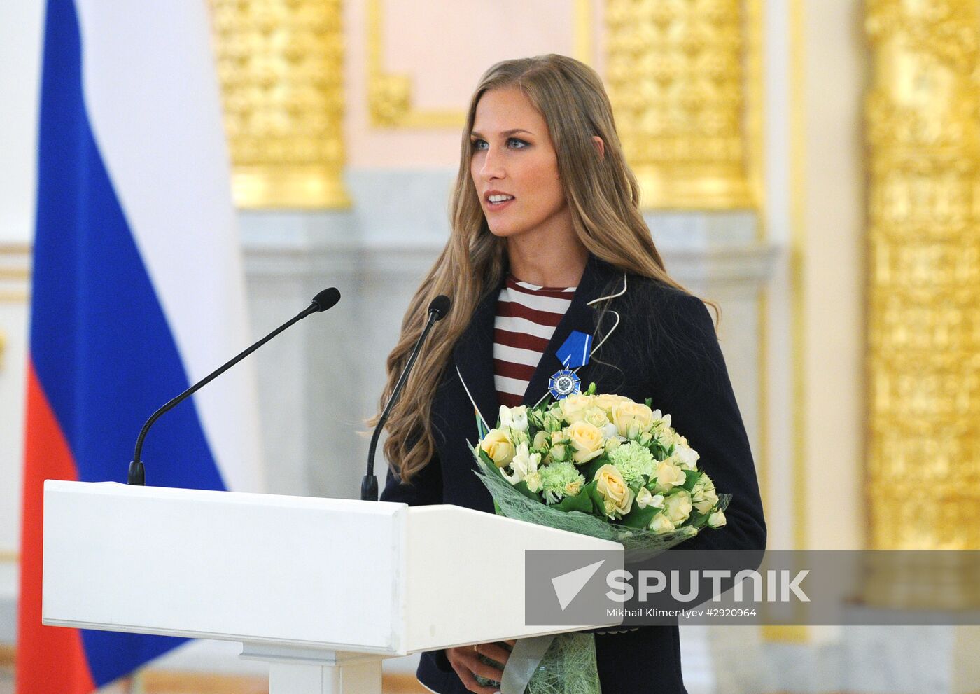 President Vladimir Putin gives government awards to Olympic medalists