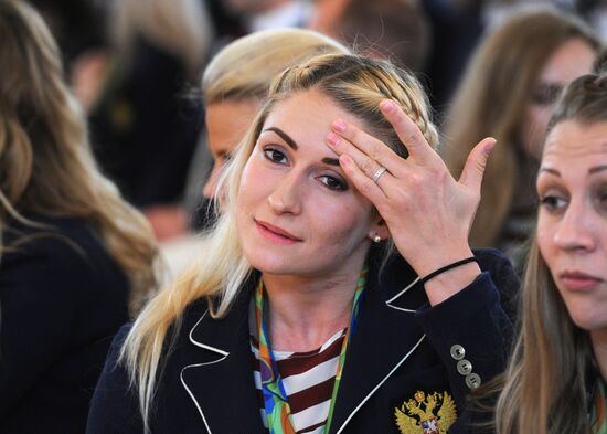 President Vladimir Putin gives government awards to Olympic medalists