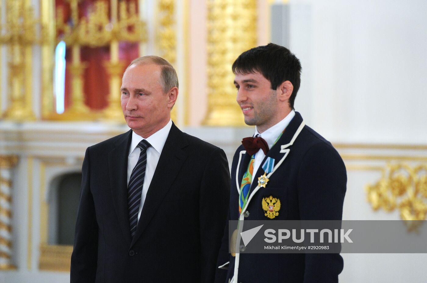 President Vladimir Putin gives government awards to Olympic medalists