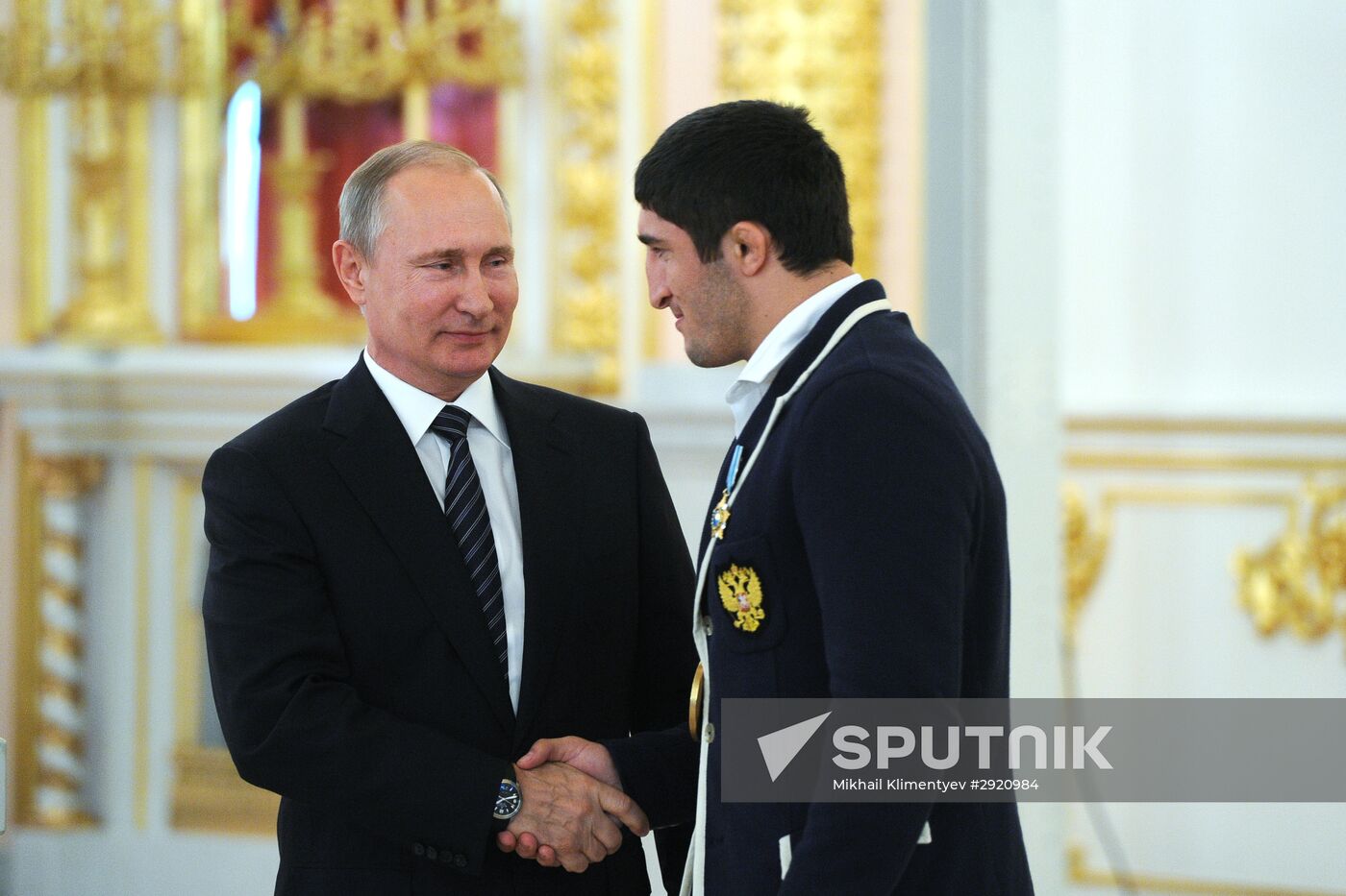 President Vladimir Putin gives government awards to Olympic medalists