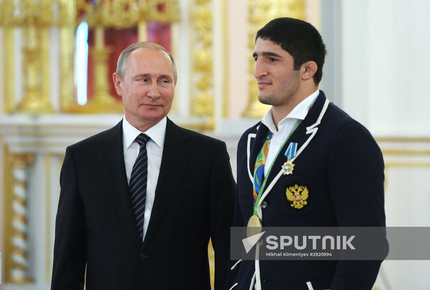 President Vladimir Putin gives government awards to Olympic medalists
