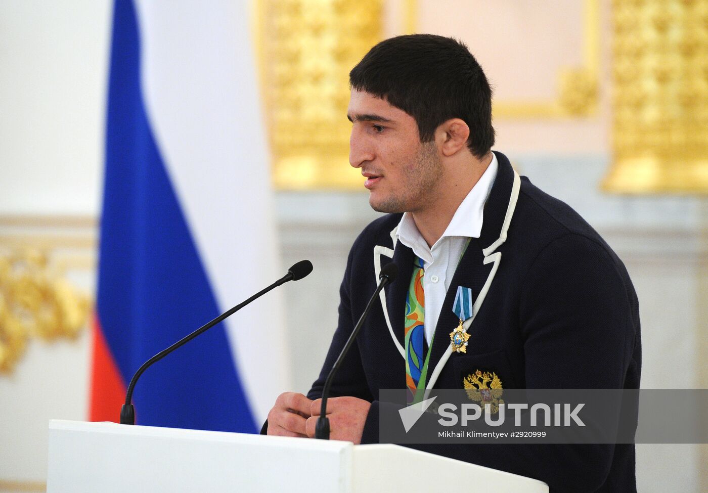 President Vladimir Putin gives government awards to Olympic medalists