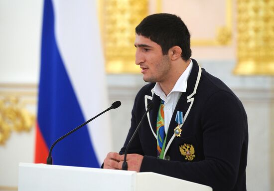 President Vladimir Putin gives government awards to Olympic medalists