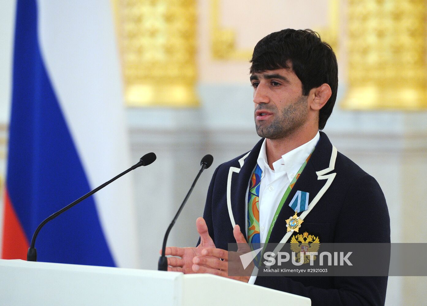 President Vladimir Putin gives government awards to Olympic medalists