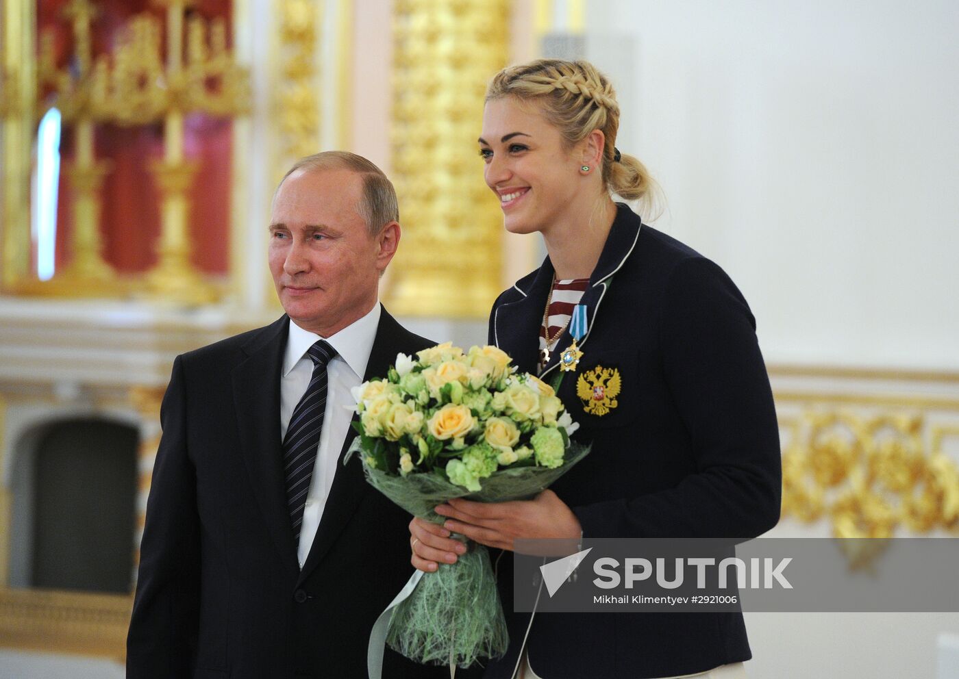 President Vladimir Putin gives government awards to Olympic medalists