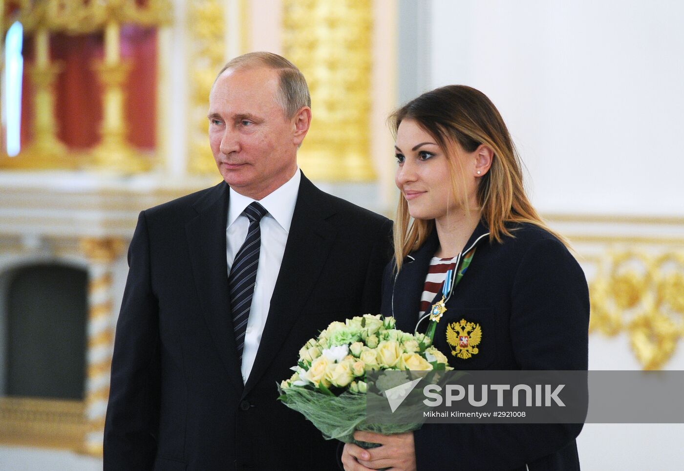 President Vladimir Putin gives government awards to Olympic medalists