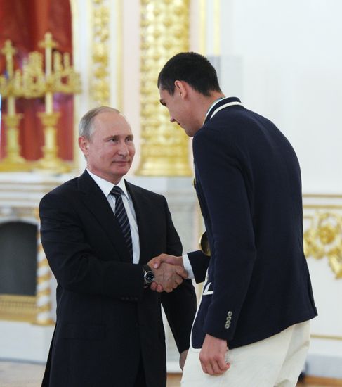 President Vladimir Putin gives government awards to Olympic medalists