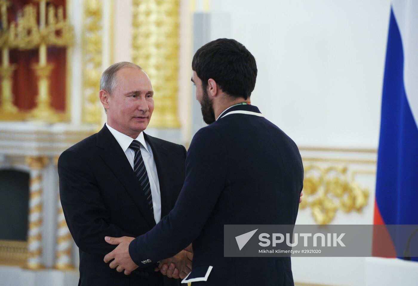 President Vladimir Putin gives government awards to Olympic medalists
