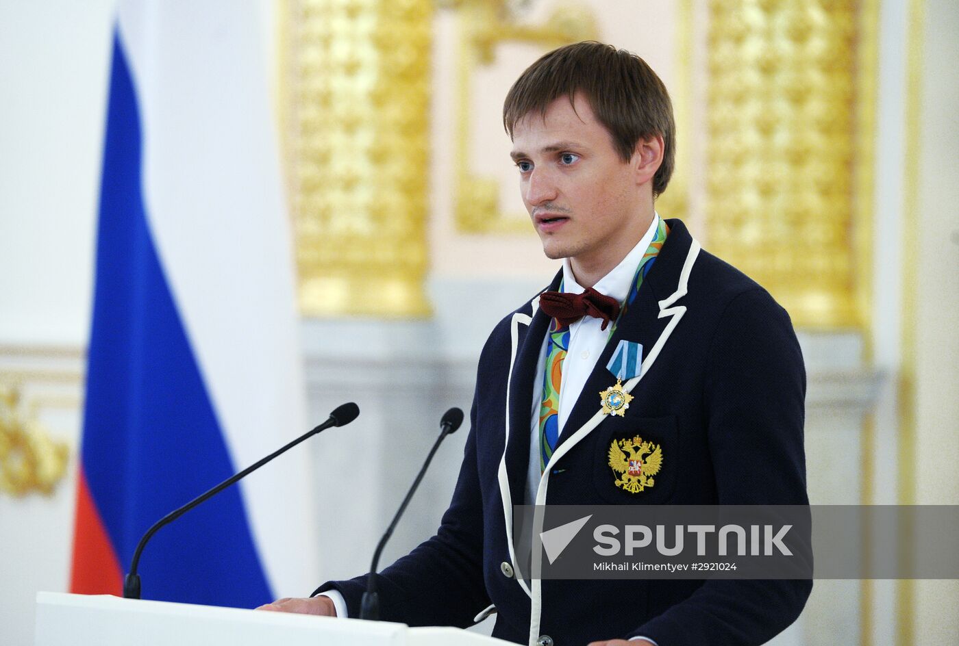 President Vladimir Putin gives government awards to Olympic medalists