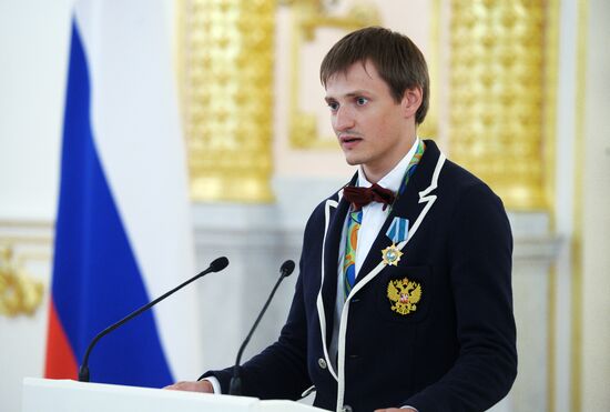 President Vladimir Putin gives government awards to Olympic medalists