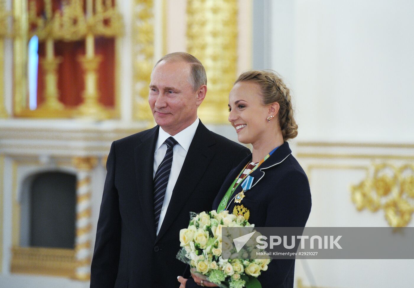 President Vladimir Putin gives government awards to Olympic medalists