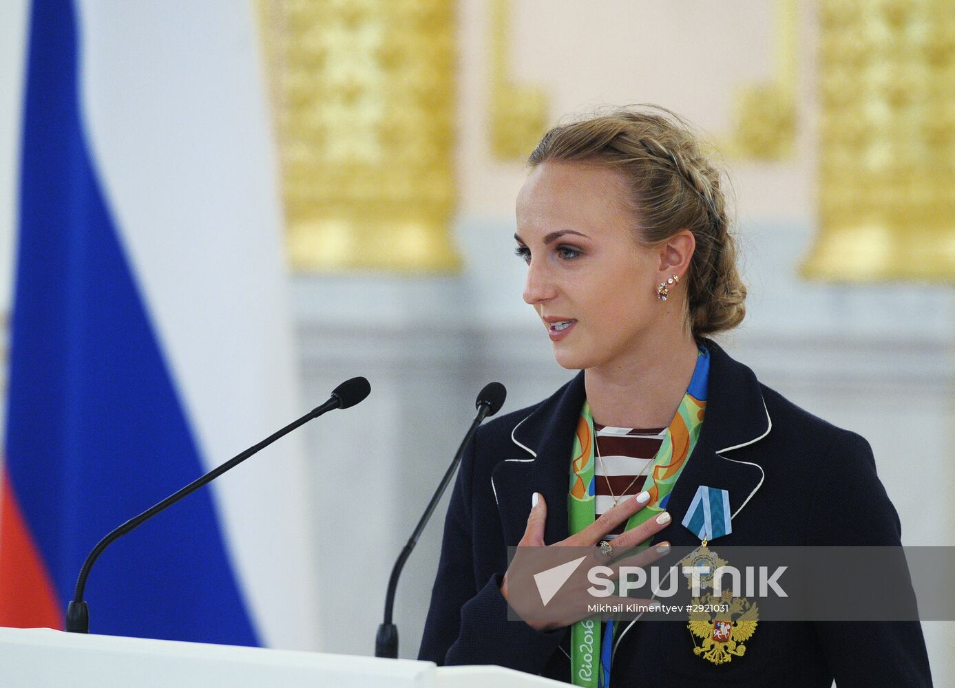 President Vladimir Putin gives government awards to Olympic medalists