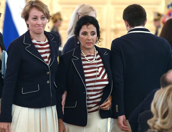 President Vladimir Putin gives government awards to Olympic medalists