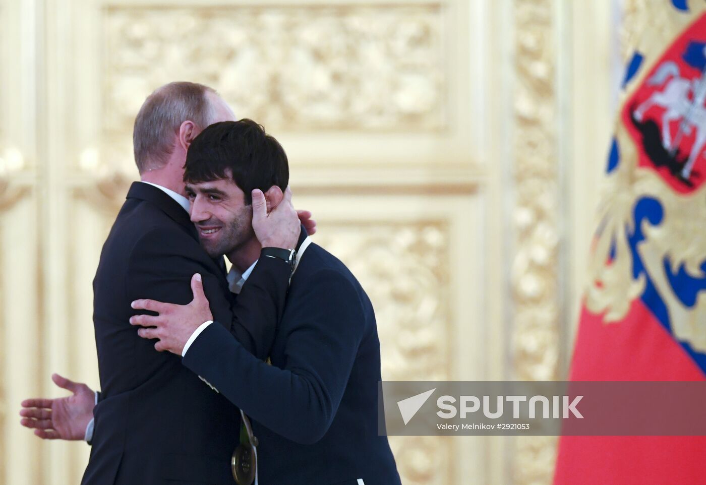 President Vladimir Putin gives government awards to Olympic medalists