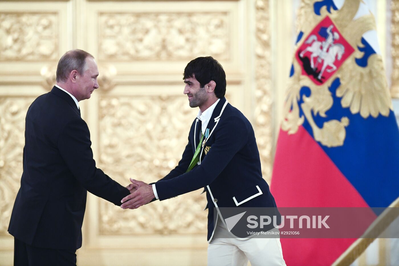 President Vladimir Putin gives government awards to Olympic medalists